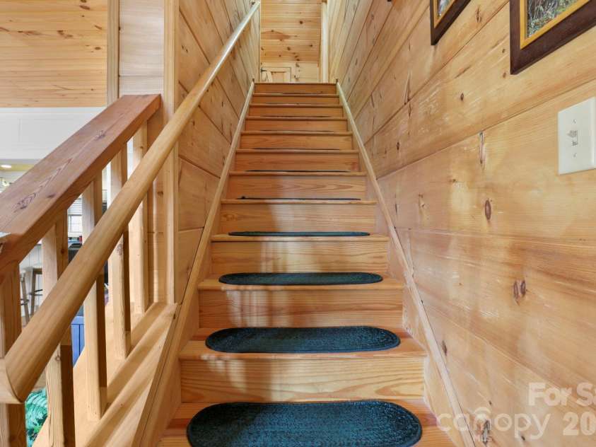 78 Longview Ridge Road, Lake Toxaway, NC 28747.  MLS# CAR4356408, YatesRealty ID 10319. Steps going upstairs