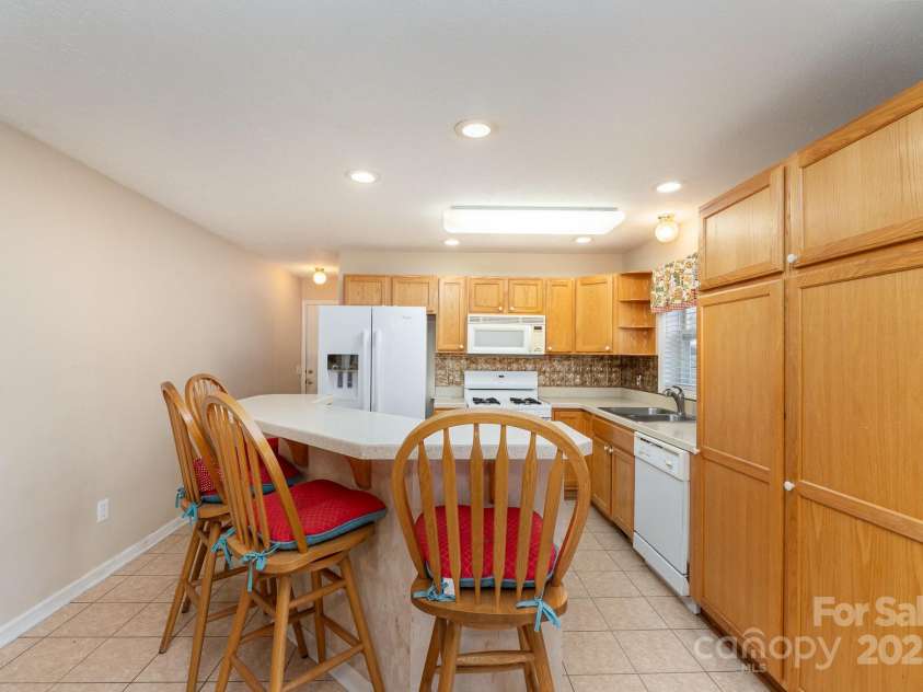 24697 Ramsey Drive, Albemarle, NC 28001.  MLS# CAR4227470, YatesRealty ID 10321. Breakfast Bar & Kitchen View with Built in Pantry