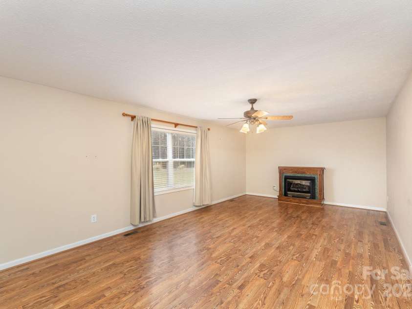 24697 Ramsey Drive, Albemarle, NC 28001.  MLS# CAR4227470, YatesRealty ID 10321. Livingroom with Fireplace (Gas)