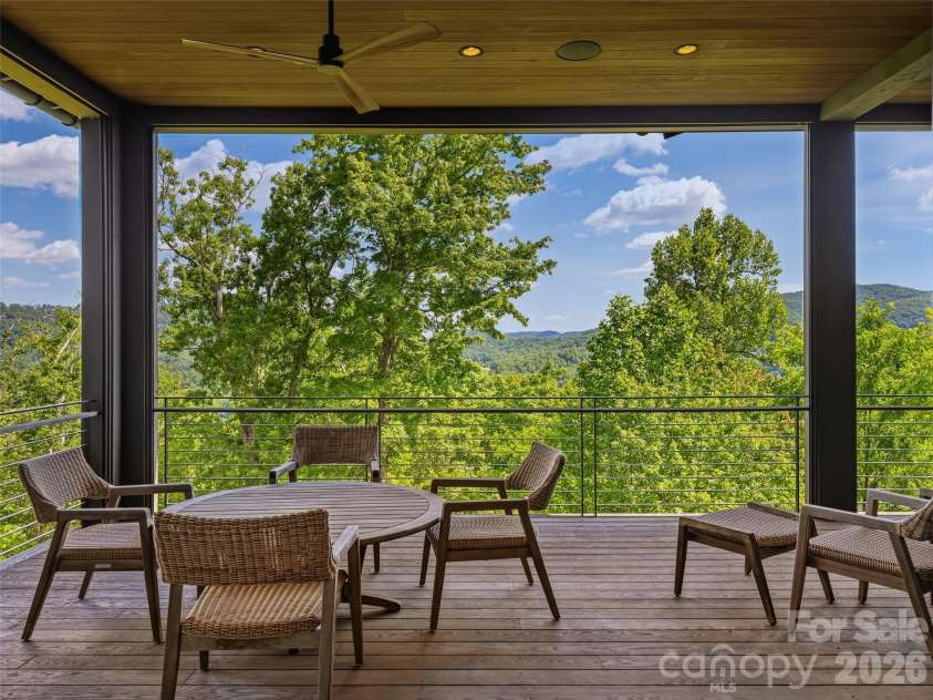 1121 Timberbluff Way, Arden, NC 28704.  MLS# CAR4389216, YatesRealty ID 10325. Covered lower terrace overlooking the mountains
