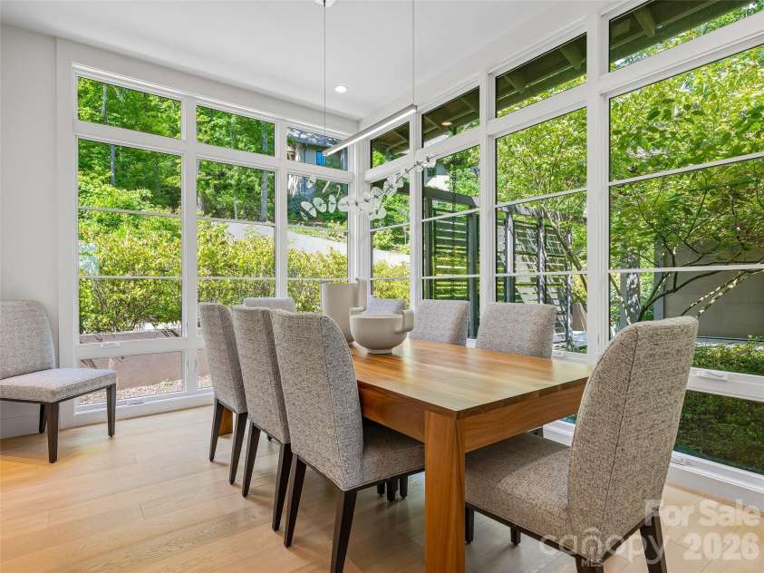 1121 Timberbluff Way, Arden, NC 28704.  MLS# CAR4389216, YatesRealty ID 10325. Elegant dining space designed for intimate dinners and larger gatherings