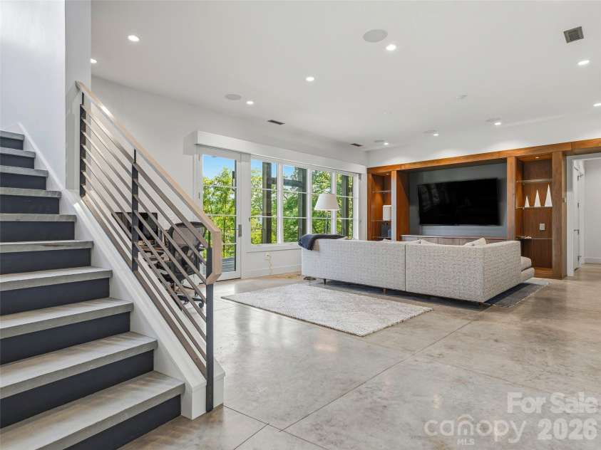 1121 Timberbluff Way, Arden, NC 28704.  MLS# CAR4389216, YatesRealty ID 10325. Expansive lower-level family room
