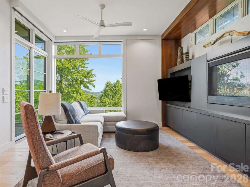 1121 Timberbluff Way, Arden, NC 28704.  MLS# CAR4389216, YatesRealty ID 10325. Relax and enjoy panoramic southern mountain vistas from the den