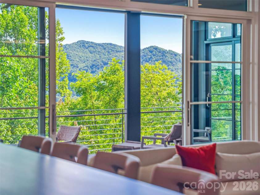 1121 Timberbluff Way, Arden, NC 28704.  MLS# CAR4389216, YatesRealty ID 10325. Seamless connection between entertaining spaces and outdoor scenery