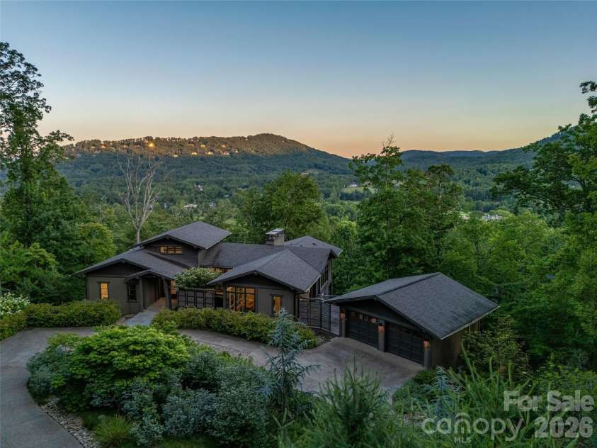 1121 Timberbluff Way, Arden, NC 28704.  MLS# CAR4389216, YatesRealty ID 10325. Sunset over the Blue Ridge Mountains viewed from the property