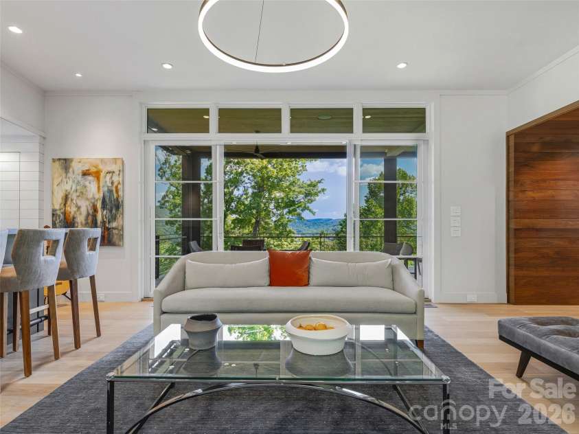 1121 Timberbluff Way, Arden, NC 28704.  MLS# CAR4389216, YatesRealty ID 10325. Walls of glass frame panoramic mountain vistas