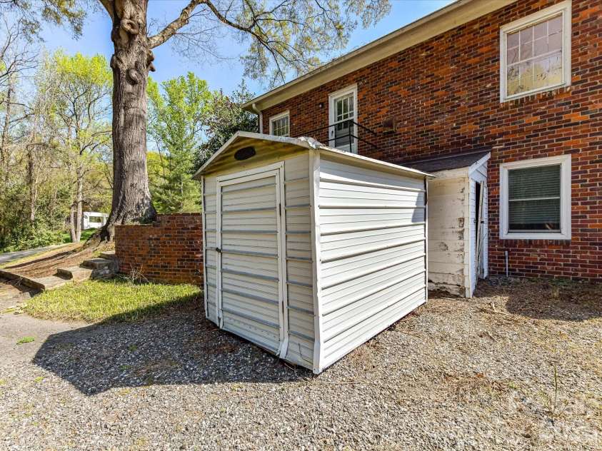 556 Eastway Street, Davidson, NC 28036.  MLS# CAR4365491, YatesRealty ID 10328. Detached storage shed provides additional space for tools, equipment, or outdoor storage needs.