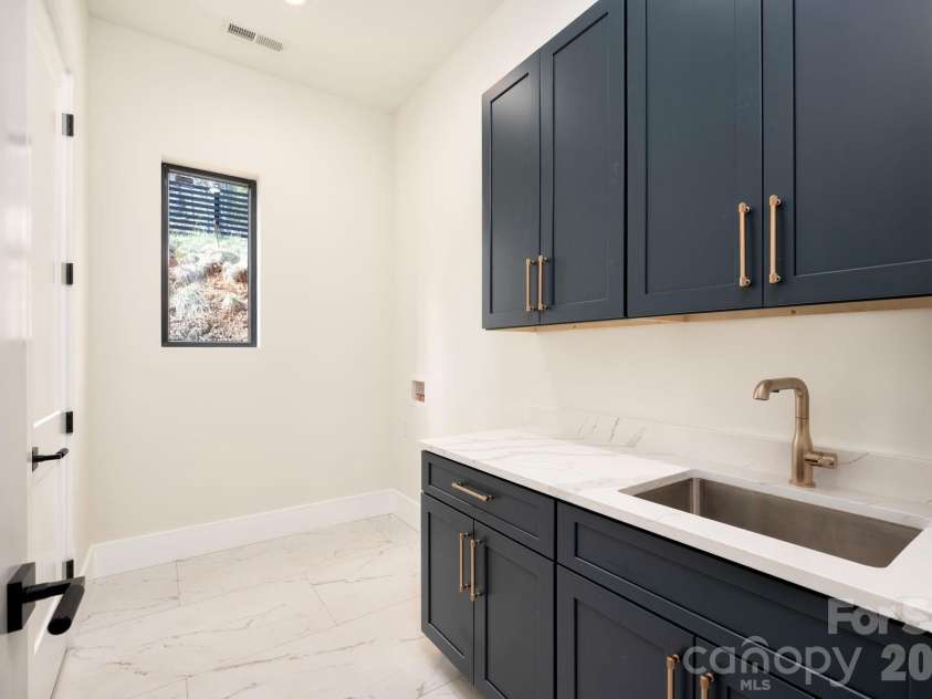 48 Carden Road, Weaverville, NC 28787.  MLS# CAR4363277, YatesRealty ID 10329. Laundry