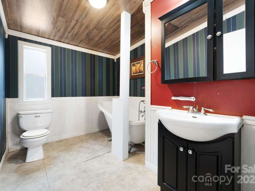 242 Breezy Mountain Lane, Mills River, NC 28759.  MLS# CAR4215866, YatesRealty ID 10330. Guest Bathroom.