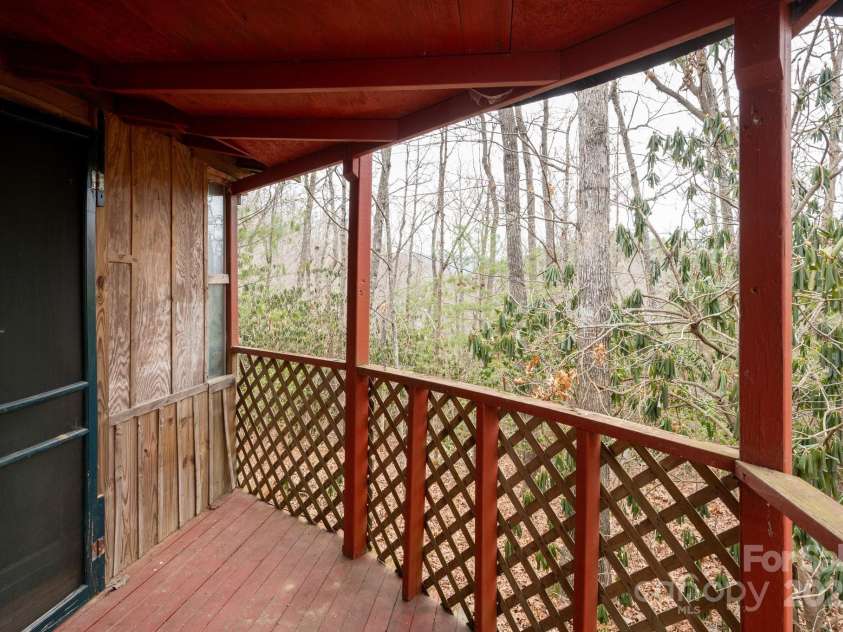242 Breezy Mountain Lane, Mills River, NC 28759.  MLS# CAR4215866, YatesRealty ID 10330. Side enclosed porch of Primary bedroom entry.