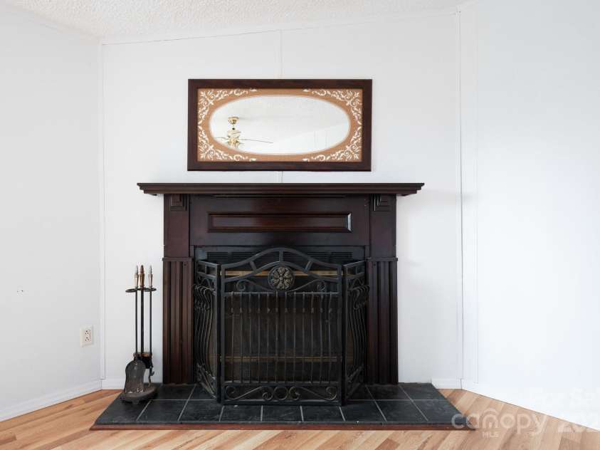 242 Breezy Mountain Lane, Mills River, NC 28759.  MLS# CAR4215866, YatesRealty ID 10330. Wood burning fireplace.