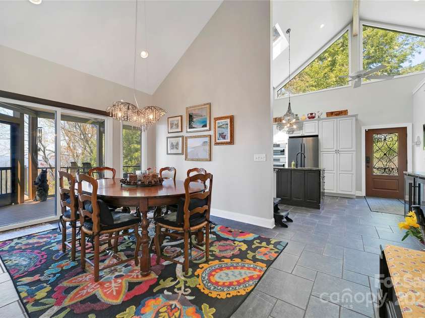 170 Oakanoah Court, Brevard, NC 28712.  MLS# CAR4247487, YatesRealty ID 10350. Dining Opens to Screened Porch