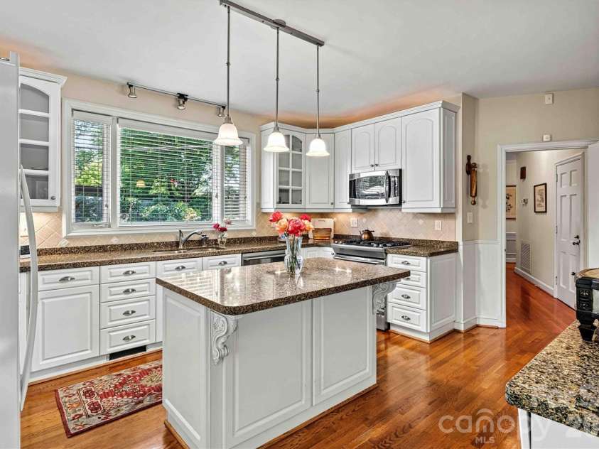 842 North Center Street, Hickory, NC 28601.  MLS# CAR4368578, YatesRealty ID 10351. Kitchen/Rose Garden Window View