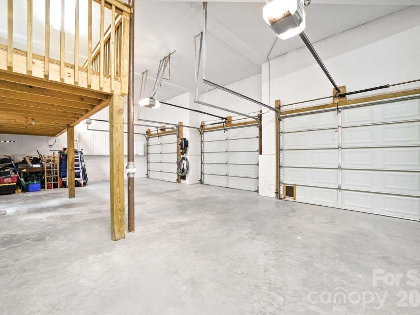 206 Vauxhall Drive, Shelby, NC 28150.  MLS# CAR4366232, YatesRealty ID 10352. Three car garage with above storage. Full size SUVs and Trucks can pull under the storage area.  There is also a workshop area.