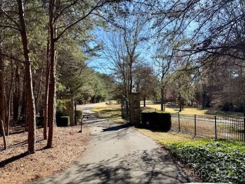 20711 Bethel Church Road, Cornelius, NC 28031.  MLS# CAR4225782, YatesRealty ID 1036. Gated entrance to 7+ acre estate