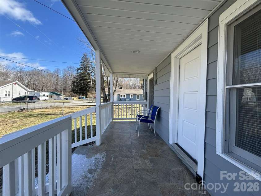 29 Fifth Street, Waynesville, NC 28786.  MLS# CAR4346674, YatesRealty ID 10360. Covered front deck.