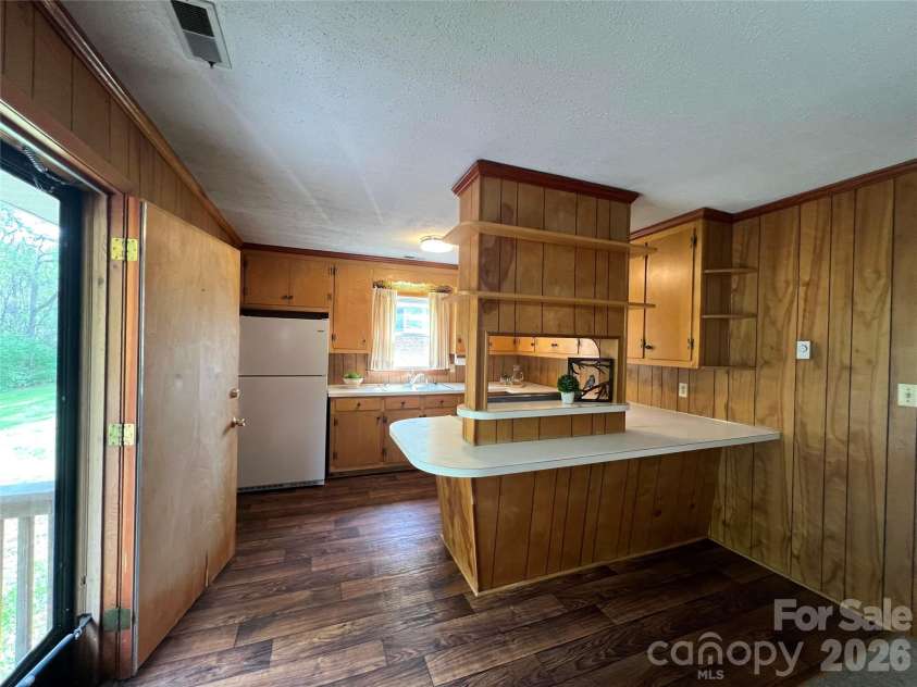 1004 Hoke Street, Kannapolis, NC 28081.  MLS# CAR4368033, YatesRealty ID 10363. Kitchen showing backdoor access to deck