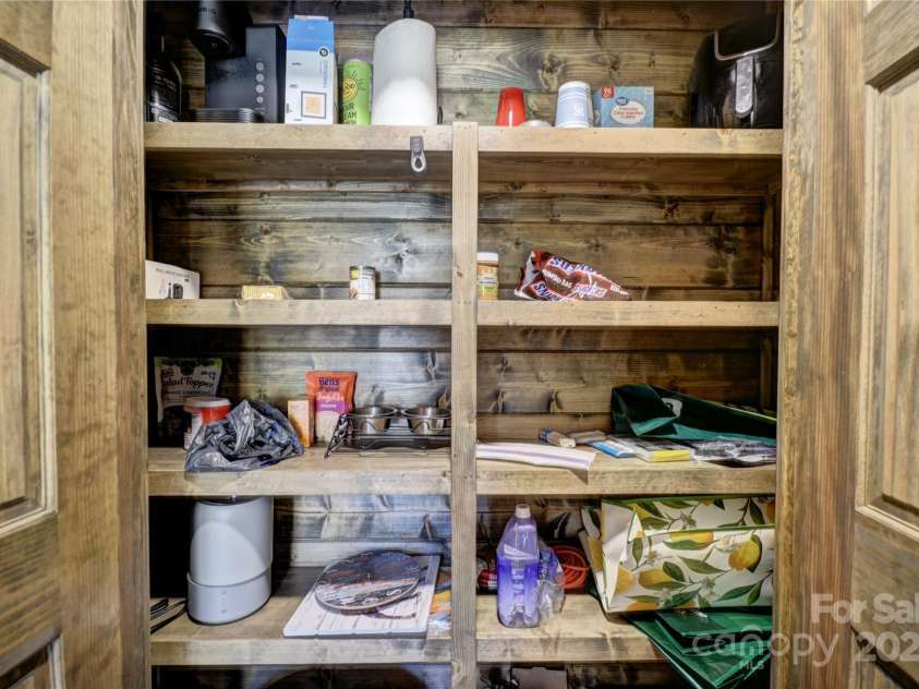 601 Tater Patch Road, Maggie Valley, NC 28751.  MLS# CAR4251873, YatesRealty ID 10378. Double-door pantry just off the kitchen