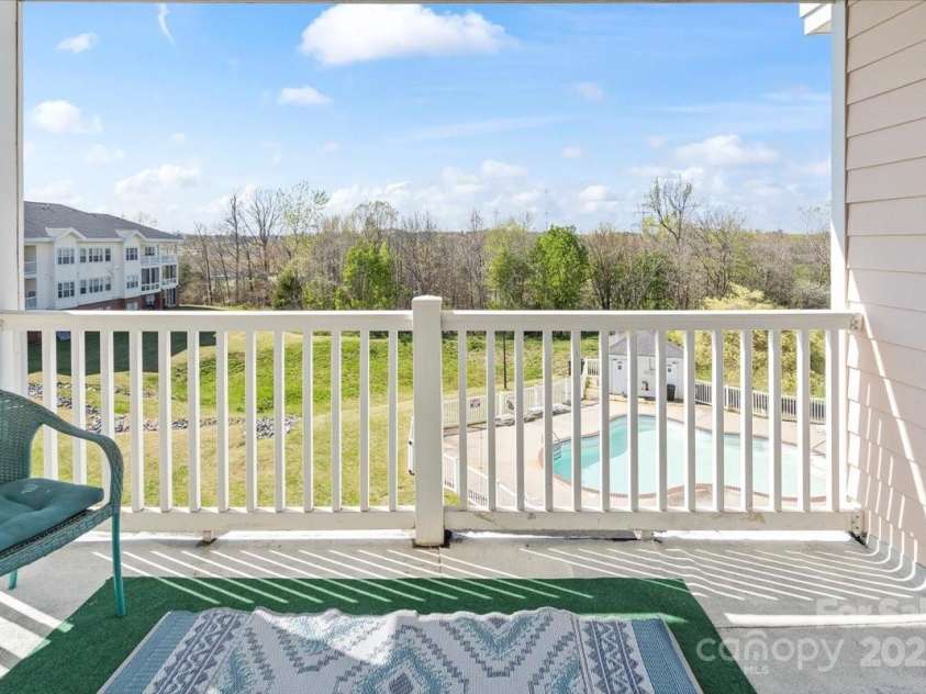9063 Meadow Vista Road, Charlotte, NC 28213.  MLS# CAR4237822, YatesRealty ID 10397. Balcony overlooking the pool