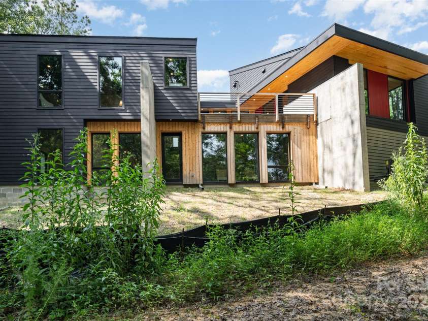 386 Squirrel Lane, Lake Wylie, SC 29710.  MLS# CAR4263022, YatesRealty ID 1040. Rear view from water