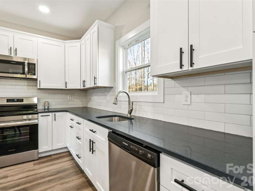 6615 Farmstead Lane, Concord, NC 28027.  MLS# CAR4357830, YatesRealty ID 10405. ADU Kitchen