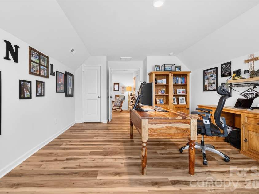 113 Saidin Lane, Troutman, NC 28166.  MLS# CAR4363898, YatesRealty ID 10408. The bonus room is at the end of the hallway providing a buffer from the rest of the home. 