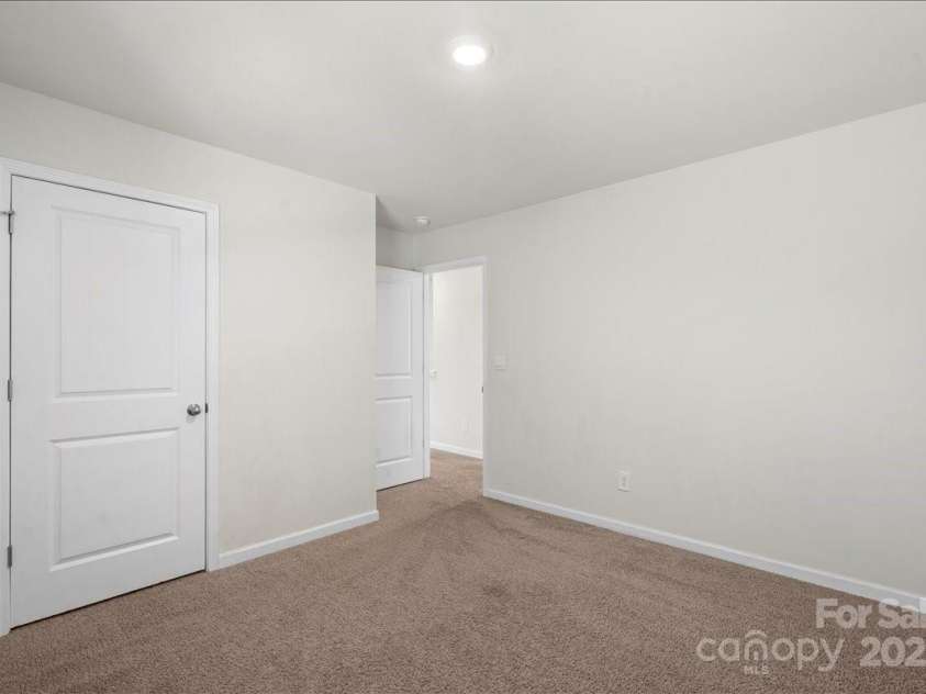 221 Wildflower Drive, Locust, NC 28097.  MLS# CAR4274547, YatesRealty ID 10414. 