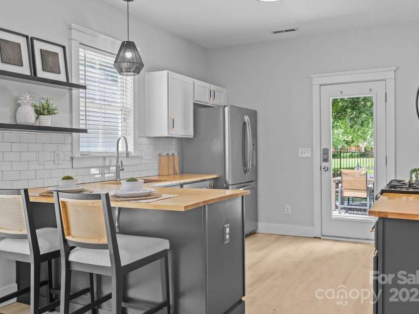 8225 Ballymore Court, Huntersville, NC 28078.  MLS# CAR4276433, YatesRealty ID 1042. Great butcher block counters. Freshly painted cabinets. The fridge conveys!