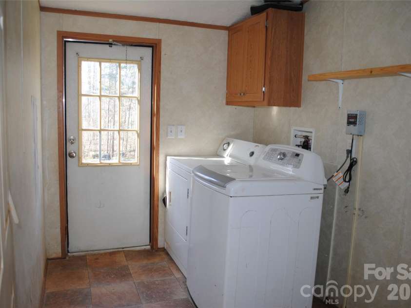 12367 Old Beatty Ford Road, Rockwell, NC 28138.  MLS# CAR4358672, YatesRealty ID 10421. Laundry/mud room to backyard.