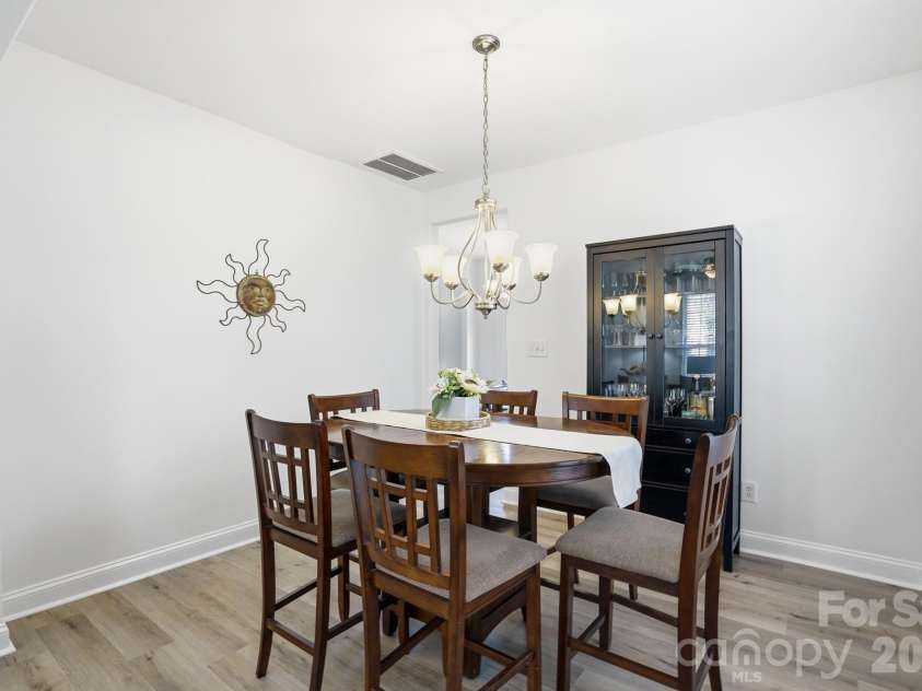10056 Paisley Drive, Charlotte, NC 28269.  MLS# CAR4364202, YatesRealty ID 10429. Dining room adjacent to flex space and kitchen