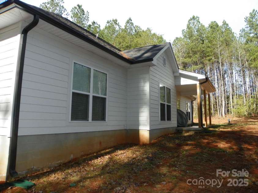 128 Summerlake Drive, New London, NC 28127.  MLS# CAR4225532, YatesRealty ID 1044. Back side of home