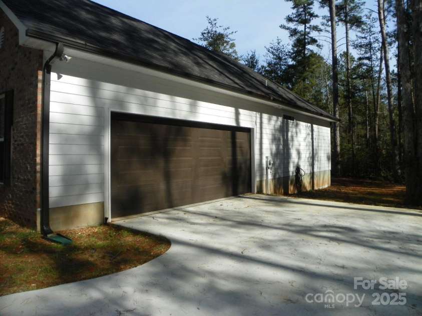 128 Summerlake Drive, New London, NC 28127.  MLS# CAR4225532, YatesRealty ID 1044. Two car attached garage