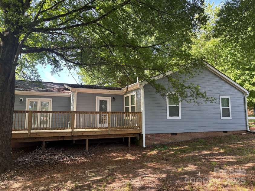 704 Guinn Street, Clover, SC 29710.  MLS# CAR4251904, YatesRealty ID 10453. Side Elevation and Deck