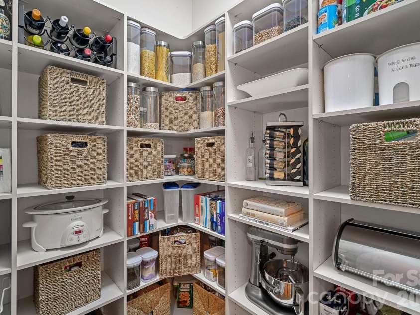 1305 Anniston Place, Wesley Chapel, NC 28079.  MLS# CAR4355553, YatesRealty ID 10457. Pantry with Shelving