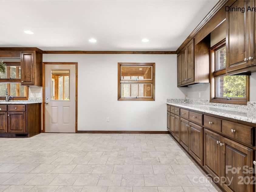 5303 Rogers Road, Monroe, NC 28110.  MLS# CAR4312504, YatesRealty ID 1046. Huge butler's pantry with under cabinet lighting 