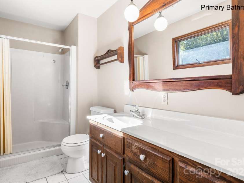 5303 Rogers Road, Monroe, NC 28110.  MLS# CAR4312504, YatesRealty ID 1046. Primary bath 