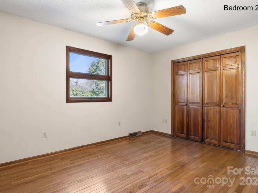 5303 Rogers Road, Monroe, NC 28110.  MLS# CAR4312504, YatesRealty ID 1046. Secondary bedroom with hardwood floors 