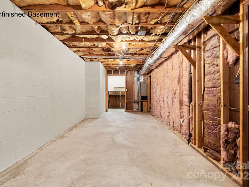 5303 Rogers Road, Monroe, NC 28110.  MLS# CAR4312504, YatesRealty ID 1046. Unfinished basement