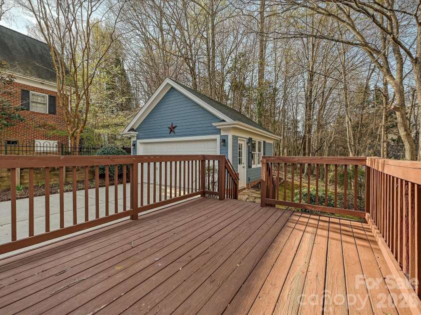 306 Ashby Drive, Davidson, NC 28036.  MLS# CAR4358205, YatesRealty ID 10461. Back deck leading to the garage and backyard