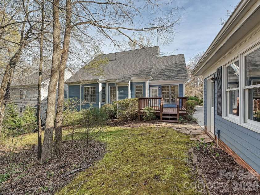 306 Ashby Drive, Davidson, NC 28036.  MLS# CAR4358205, YatesRealty ID 10461. Backyard and two-car garage