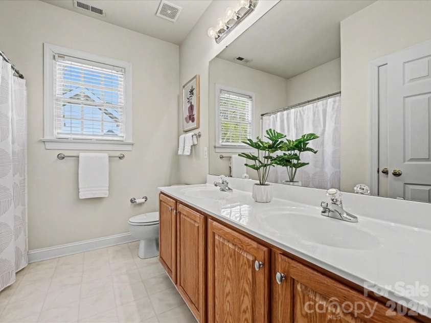 306 Ashby Drive, Davidson, NC 28036.  MLS# CAR4358205, YatesRealty ID 10461. Full bath with two vanities on the second level