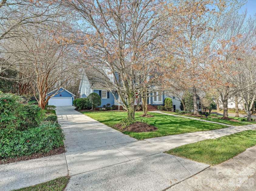 306 Ashby Drive, Davidson, NC 28036.  MLS# CAR4358205, YatesRealty ID 10461. Pretty front yard and house is nicely set off the road