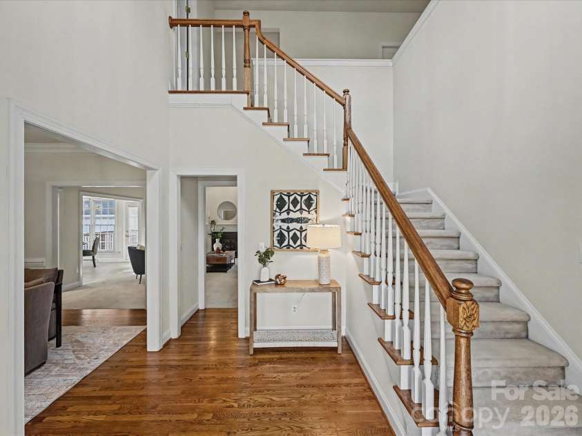 306 Ashby Drive, Davidson, NC 28036.  MLS# CAR4358205, YatesRealty ID 10461. Pretty staircase, vaulted entrance hall