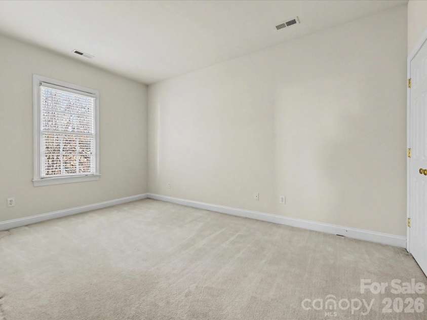 306 Ashby Drive, Davidson, NC 28036.  MLS# CAR4358205, YatesRealty ID 10461. Second bedroom on the second level