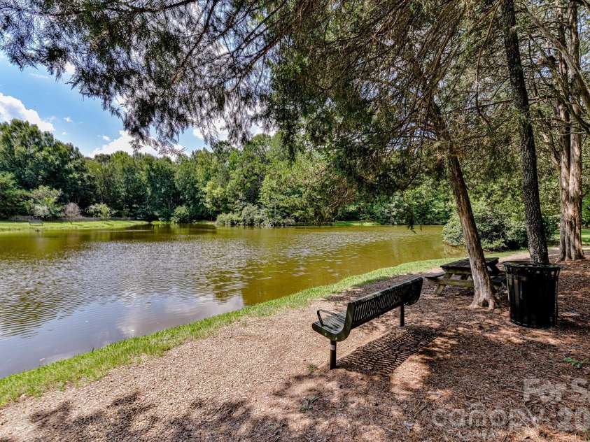 306 Ashby Drive, Davidson, NC 28036.  MLS# CAR4358205, YatesRealty ID 10461. Walking trails around the pond
