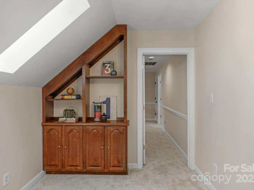 5750 Hemby Road, Matthews, NC 28104.  MLS# CAR4243817, YatesRealty ID 10461. Built-ins w sky lights upstairs lets in natural light
