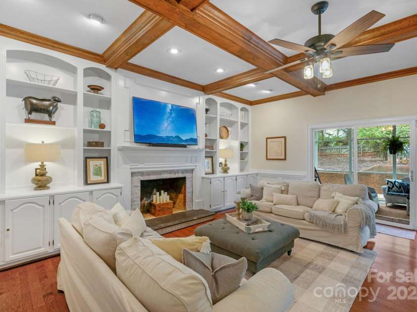 5750 Hemby Road, Matthews, NC 28104.  MLS# CAR4243817, YatesRealty ID 10461. Great Room w coffered wood beams, fireplace and hardwoods