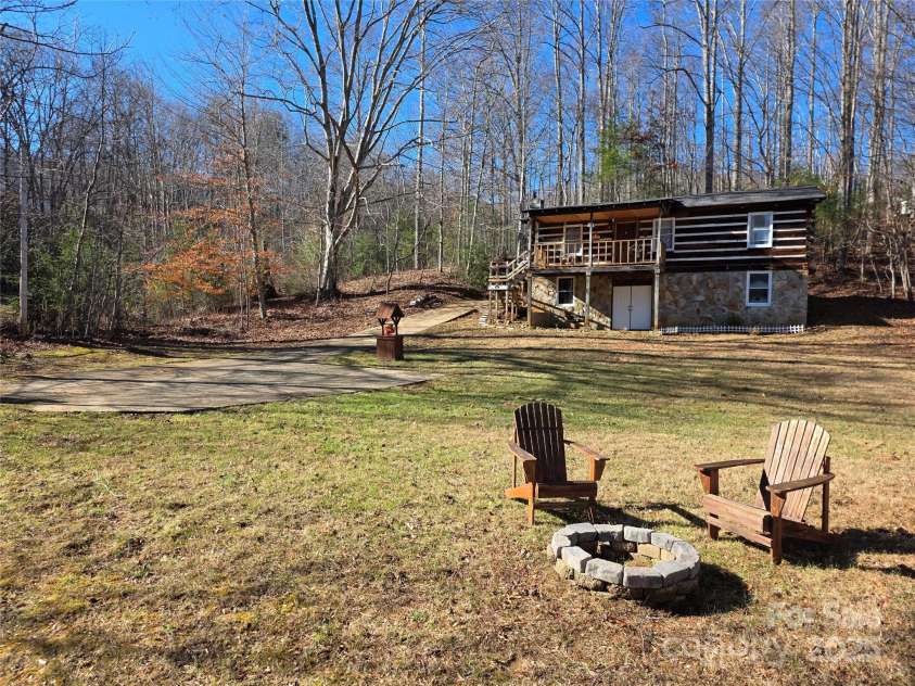 536 Hickory Springs Road, Burnsville, NC 28714.  MLS# CAR4327373, YatesRealty ID 10467. Front view with firepit