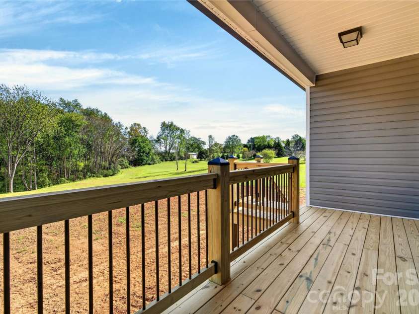 144 Tranquility Lane, Harmony, NC 28634.  MLS# CAR4366064, YatesRealty ID 10470. Covered back porch
