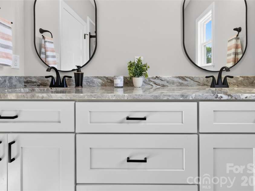 144 Tranquility Lane, Harmony, NC 28634.  MLS# CAR4366064, YatesRealty ID 10470. Double vanity in ensuite Bath